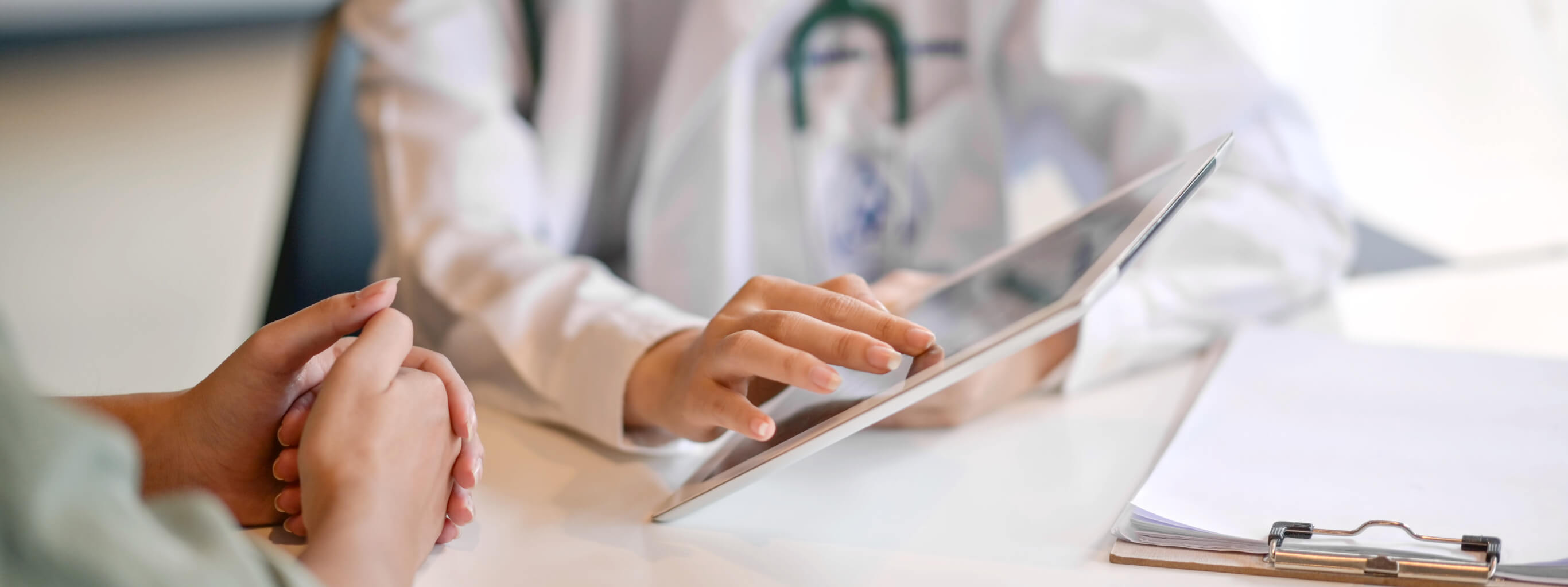 Doctor going over electronic charts with a patient